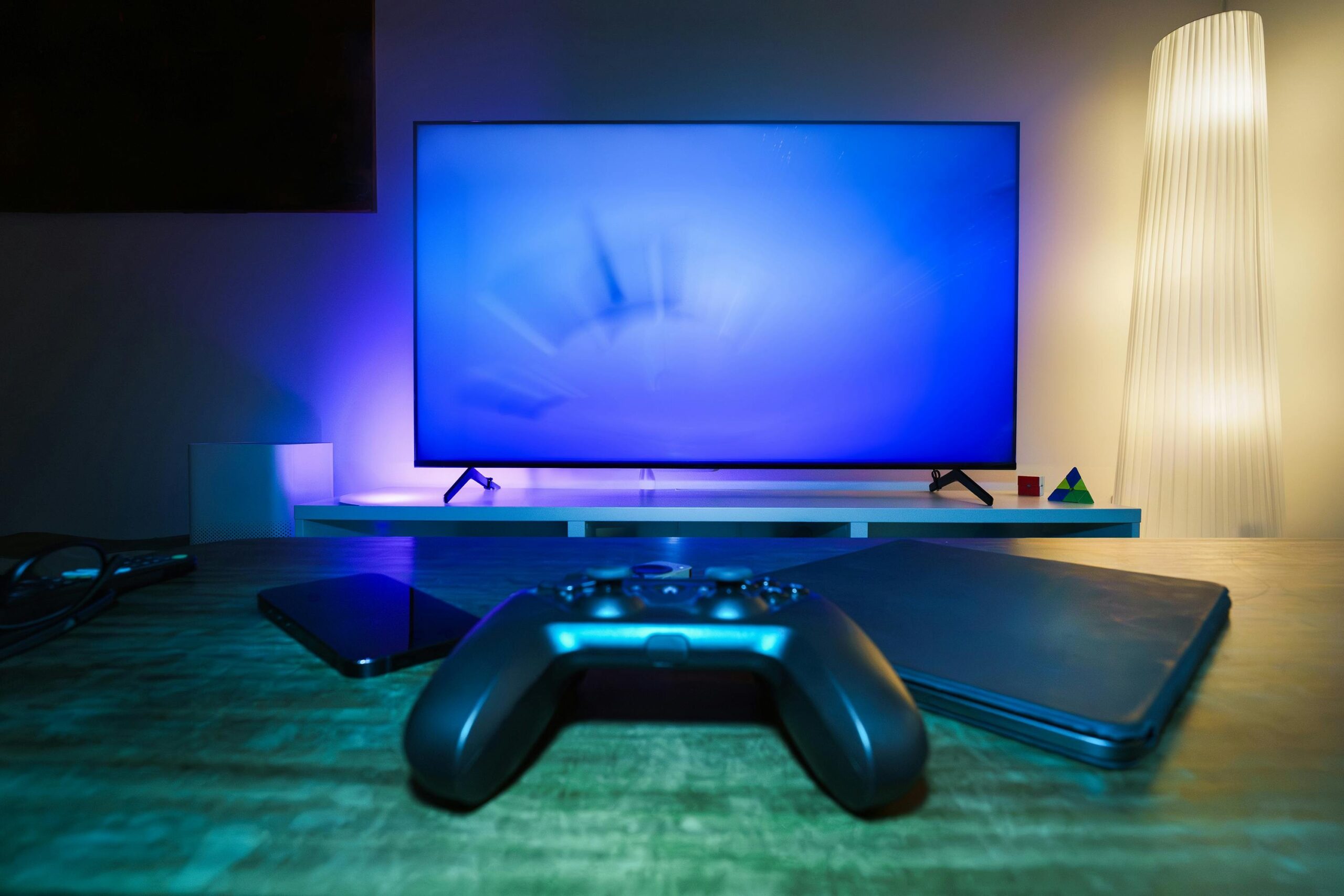 A streaming setup featuring a smart TV, gaming console, and high-speed router