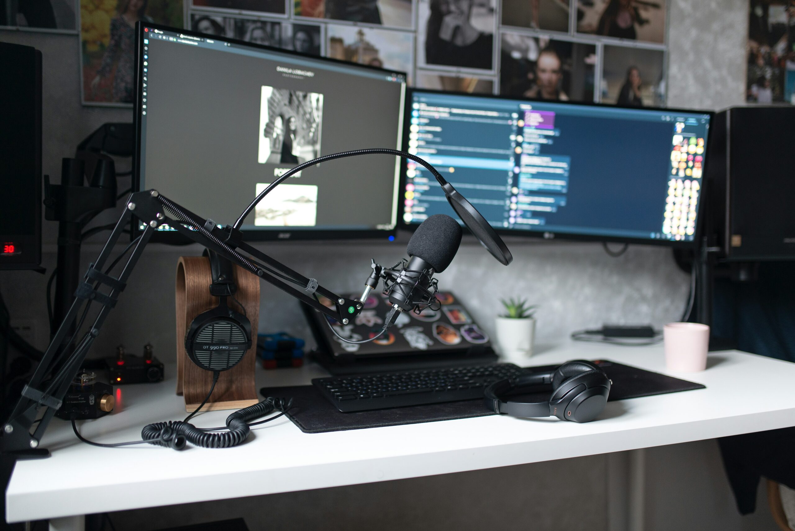 A desk setup with a microphone, webcam, and lights arranged professionally.
