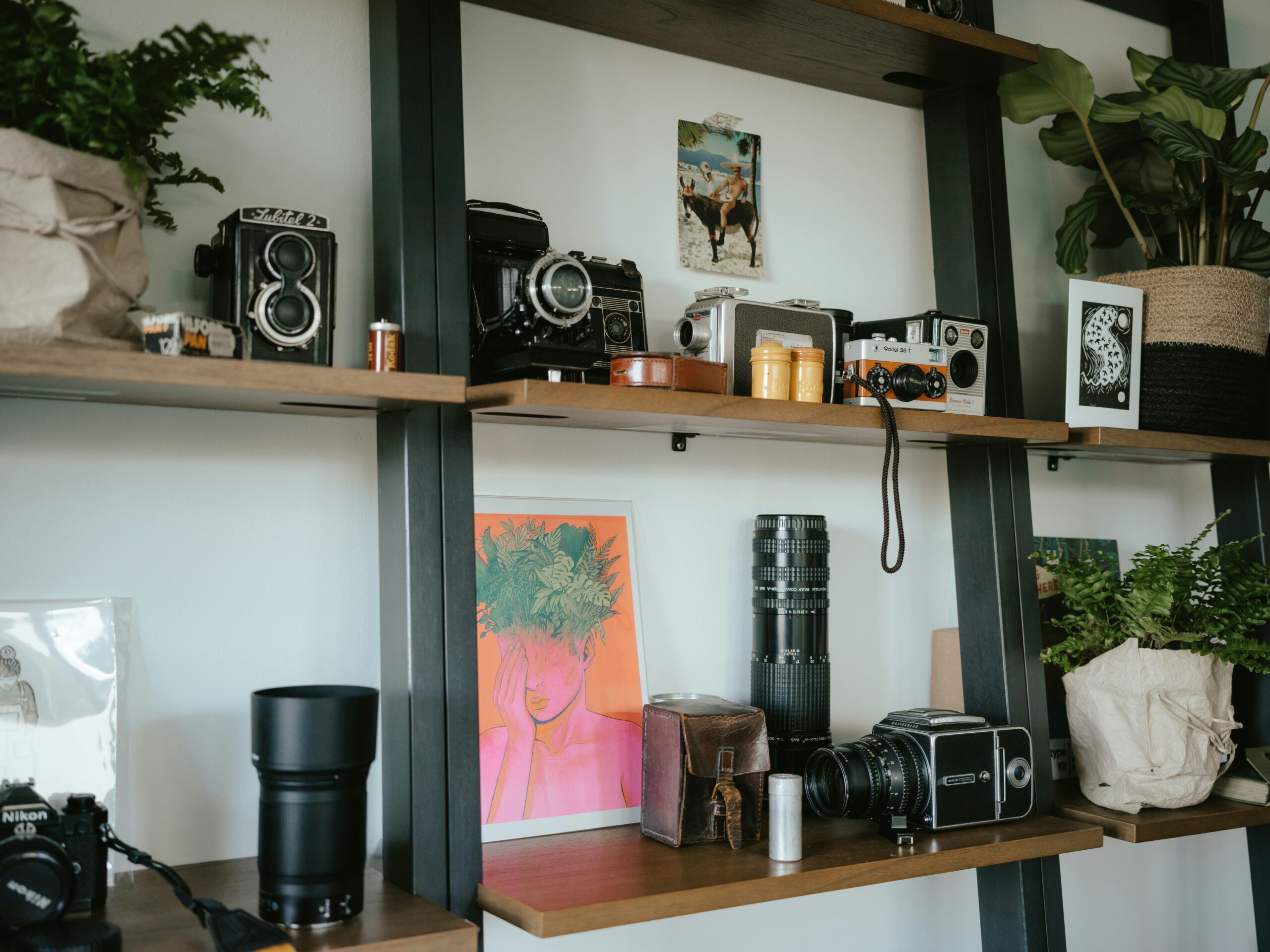 A display of refurbished microphones and webcams neatly arranged on a shelf.