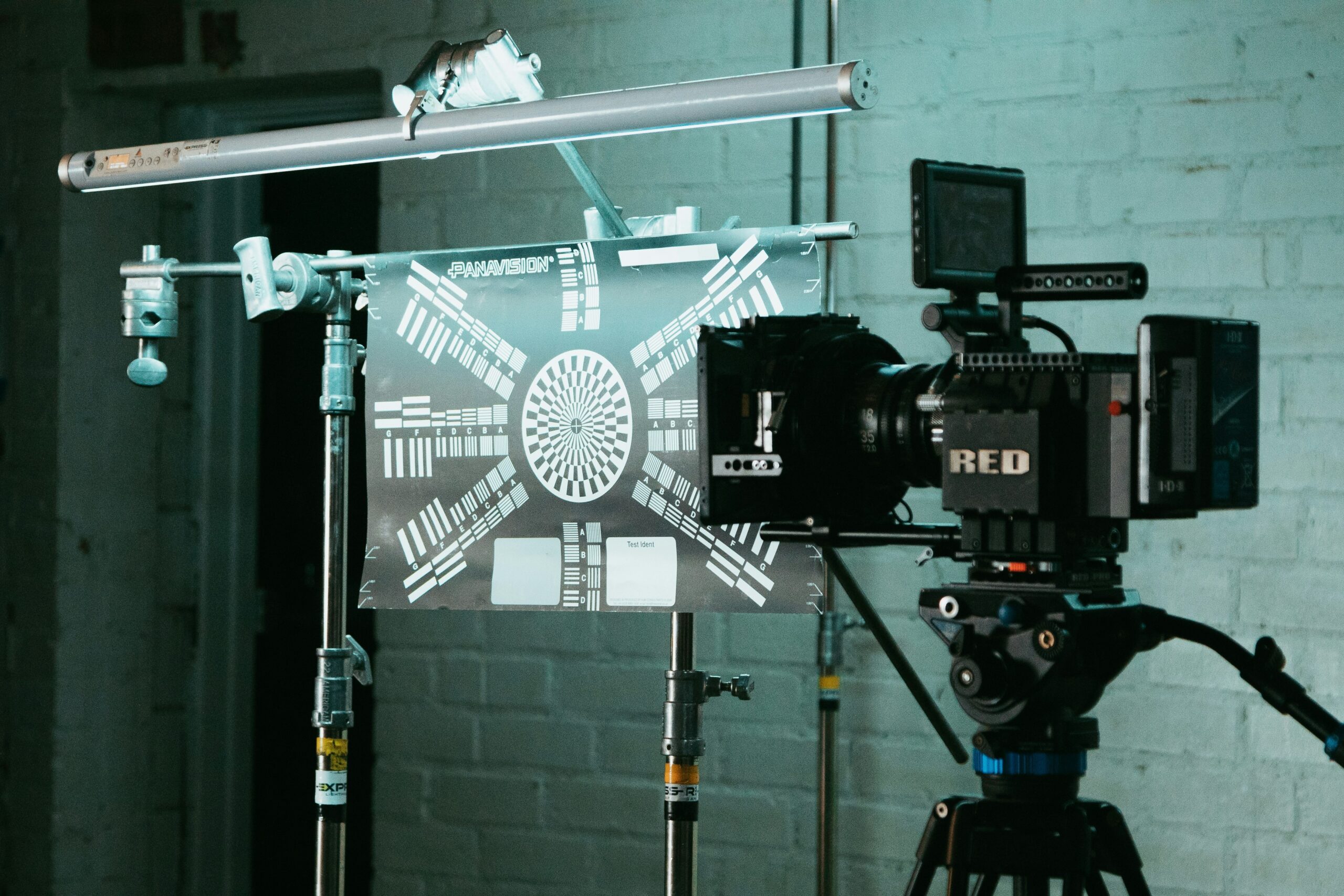 Netflix crew adjusting studio lights based on a detailed lighting diagram