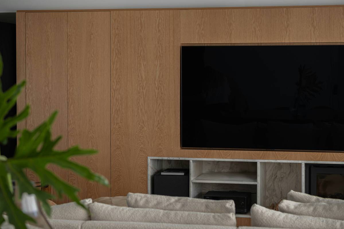 A desk setup for streaming media with multiple monitors and cables.