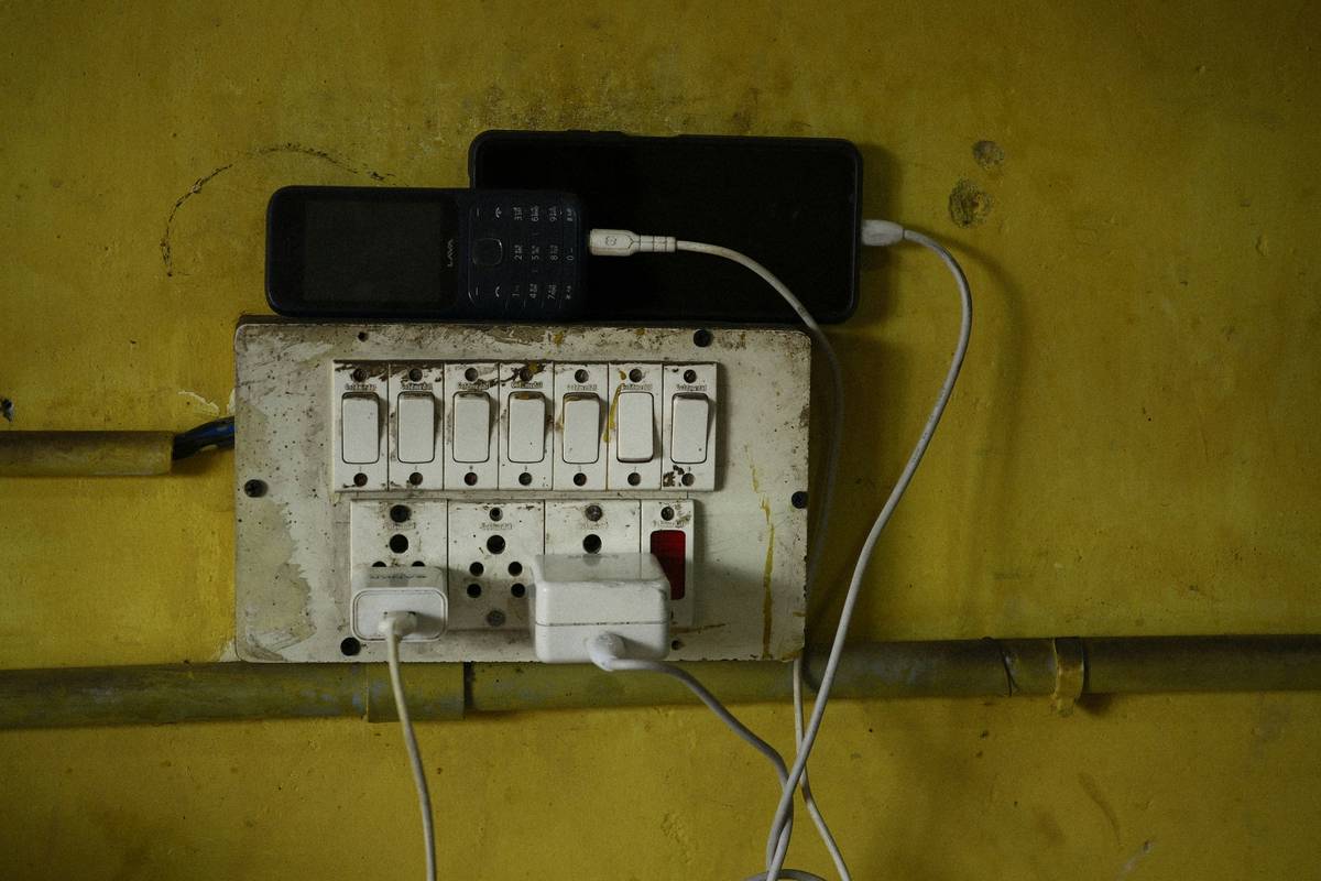 Close-up shot of hands connecting HDMI cables to a TV